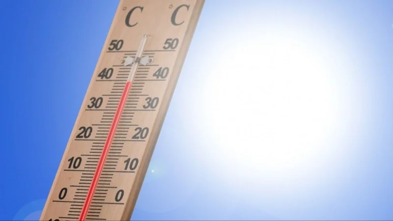 Termómetro y un sol radiante