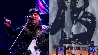 Chizzo, cantante de la renga, con una imagen de Pablo Grillo de fondo Chizzo, cantante de la renga, con una imagen de Pablo Grillo de fondo