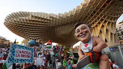 Manifestantes piden condonar deuda y medidas contra el cambio climático antes de la cumbre de la ONU Manifestantes piden condonar deuda y medidas contra el cambio climático antes de la cumbre de la ONU