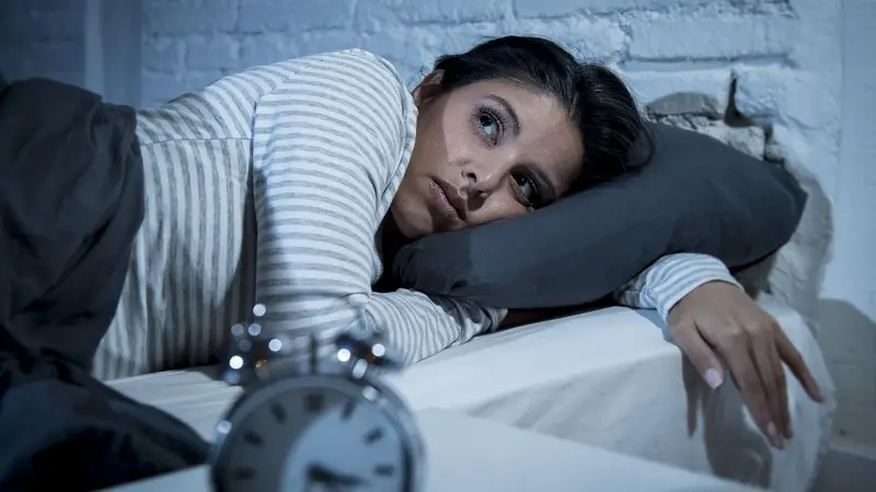 Mujer en la cama