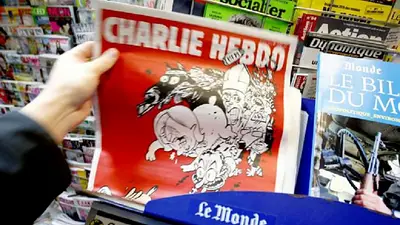 "A la mierda", la nueva tapa de Charlie Hebdo tras los atentados de París "A la mierda", la nueva tapa de Charlie Hebdo tras los atentados de París