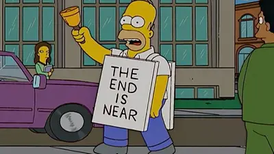 Homero con el sign de "El fin está cerca" Homero con el sign de "El fin está cerca"